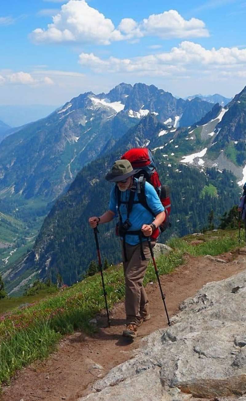 Hiker Scaling a Steep Trail